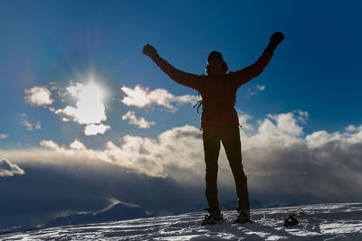 Full length of woman standing on snow