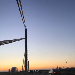 View of cranes at sunset