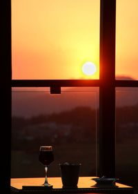 Sunset seen through glass window