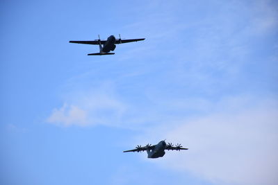 Low angle view of airplane against sky