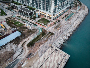 High angle view of buildings by street in city