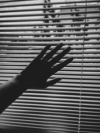 Close-up of human hand on metal