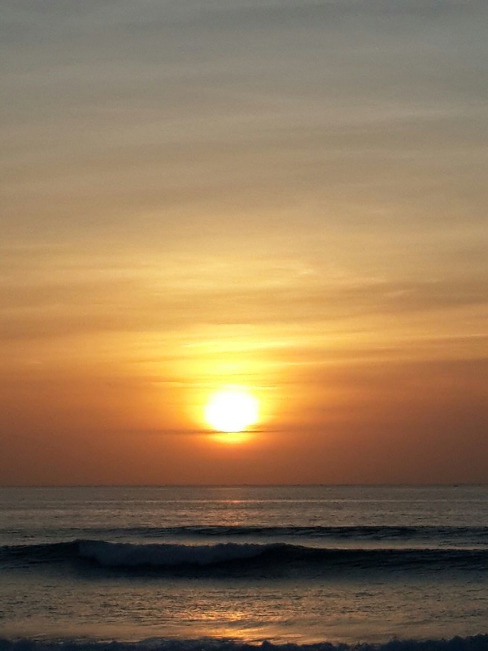 sea, horizon over water, sunset, water, beach, scenics, sun, beauty in nature, tranquil scene, orange color, tranquility, sky, shore, idyllic, wave, nature, sunlight, outdoors, remote, seascape