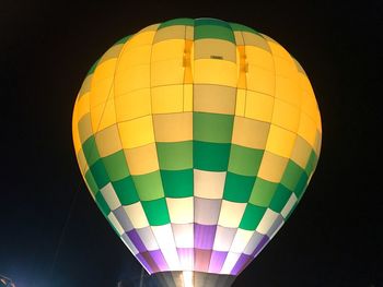 Low angle view of hot air balloons flying