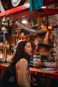 Side view of a woman in store