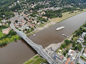 High angle view of river amidst buildings in city