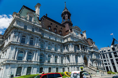 Low angle view of building against blue sky