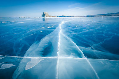 Frozen sea against blue sky