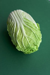 Close-up of cabbage against green background