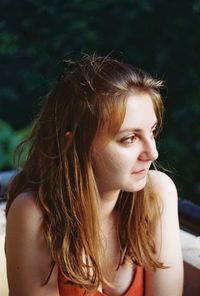 Portrait of young woman looking away