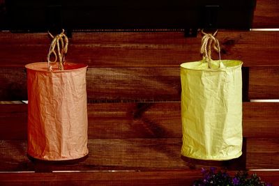 Close-up of paper lanterns hanging against wall