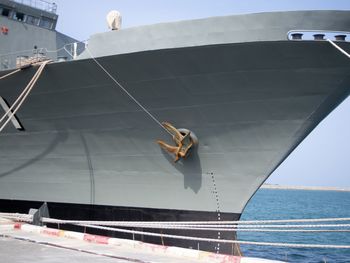 Low angle view of man on sea against sky