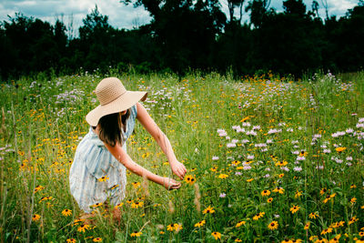 Woman wearing hat on field