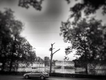 Cars on road against sky