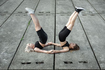 High angle view of women relaxing on floor