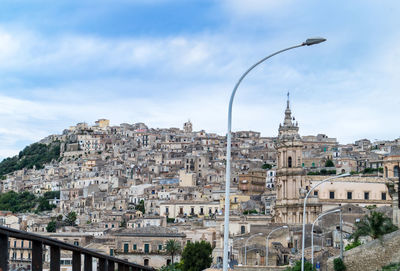 View of buildings in city against sky