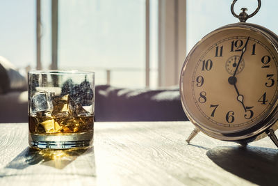 Close-up of clock on table