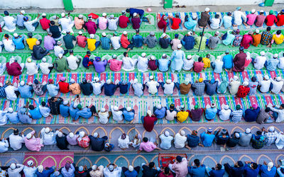 High angle view of people praying on road