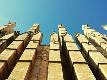 Low angle view of built structure against clear blue sky