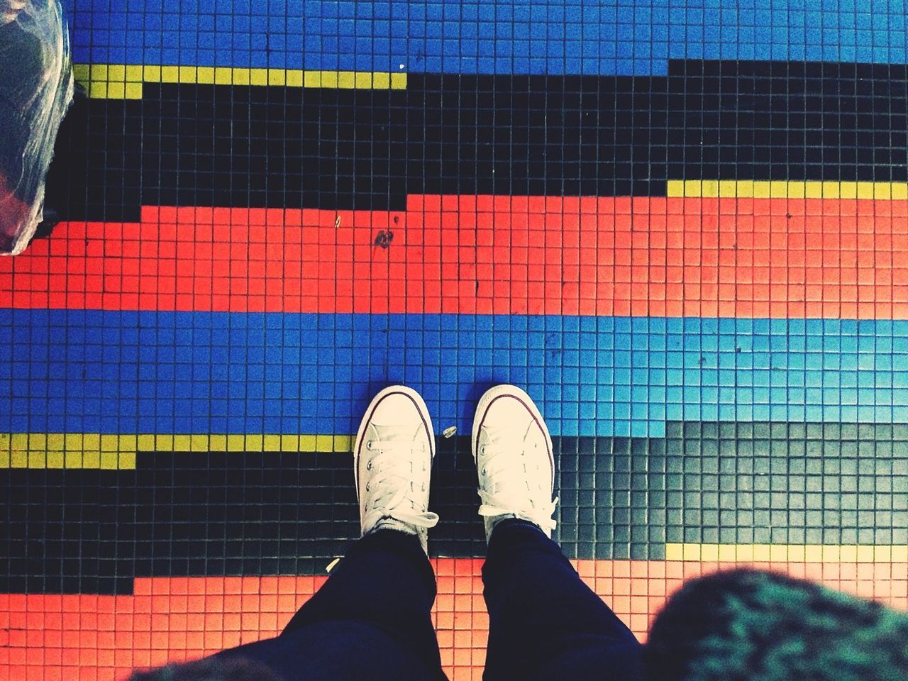 low section, person, shoe, personal perspective, standing, human foot, footwear, men, lifestyles, jeans, high angle view, directly above, unrecognizable person, canvas shoe, leisure activity, tiled floor, indoors