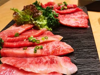 Close-up of meat on cutting board