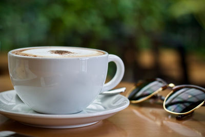 Close-up of coffee cup on table