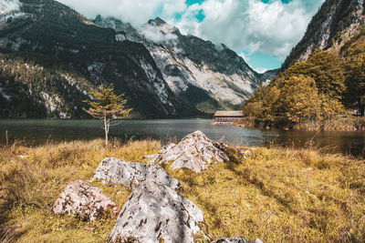 Scenic view of lake and mountains against sky