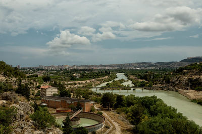 View of buildings against cloudy sky