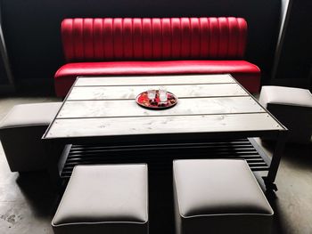 High angle view of empty chairs and table in restaurant