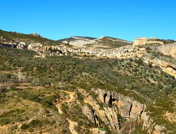 Scenic view of mountain against clear blue sky