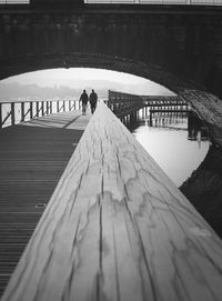 Full length of woman standing on footbridge