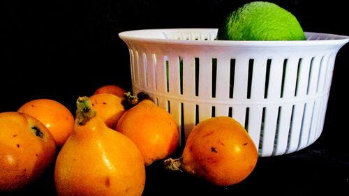 Close-up of oranges against black background