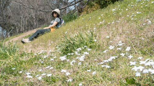 Full length of woman standing on grassy field