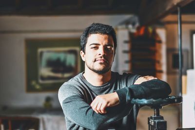 Portrait of young man at home