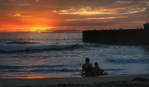 Scenic view of sea at sunset