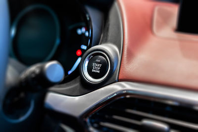 Close-up of push button with text in car
