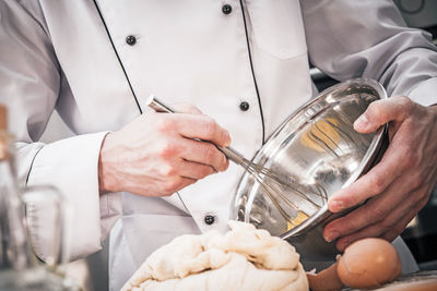 Close-up of man preparing food