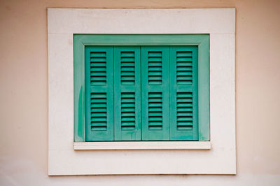 Close-up of window on white wall of building