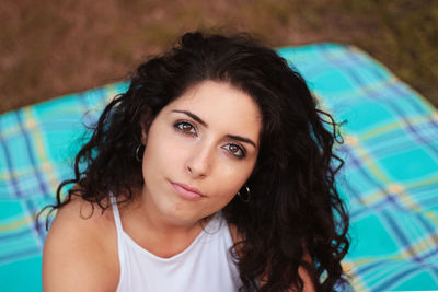 Portrait of beautiful young woman in swimming pool