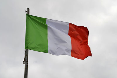 Low angle view of italian flag against sky