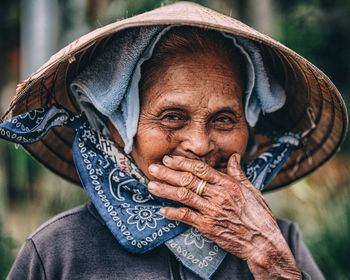 Close-up portrait of smiling mid adult woman