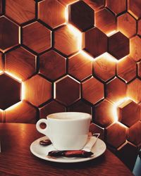 Close-up of coffee cup on table