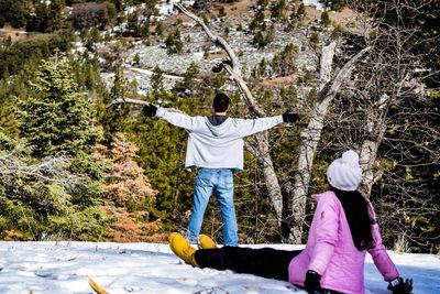 Couple on snow covered landscape