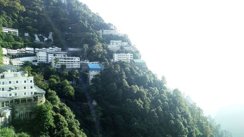 High angle view of trees and buildings against sky