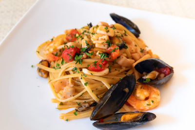 High angle view of pasta in plate on table