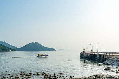 A boat on the sea and a pier in tai o