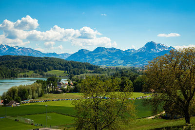 Scenic view of landscape and mountains against sky