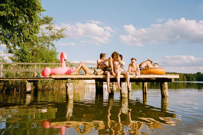 Group of friends enjoying lake