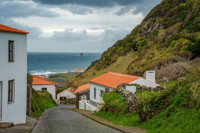 Scenic view of sea and buildings against sky