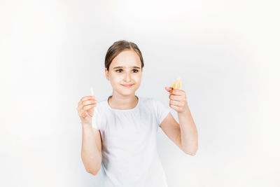 Portrait of a smiling young woman over white background